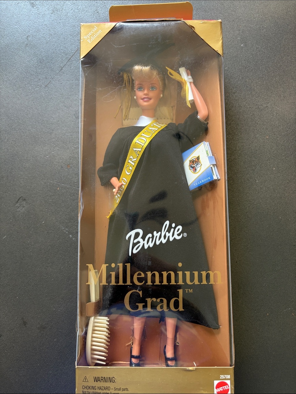 Millennium Grad Barbie Black Dress with Gold Grad Sash and Blue Yearbook